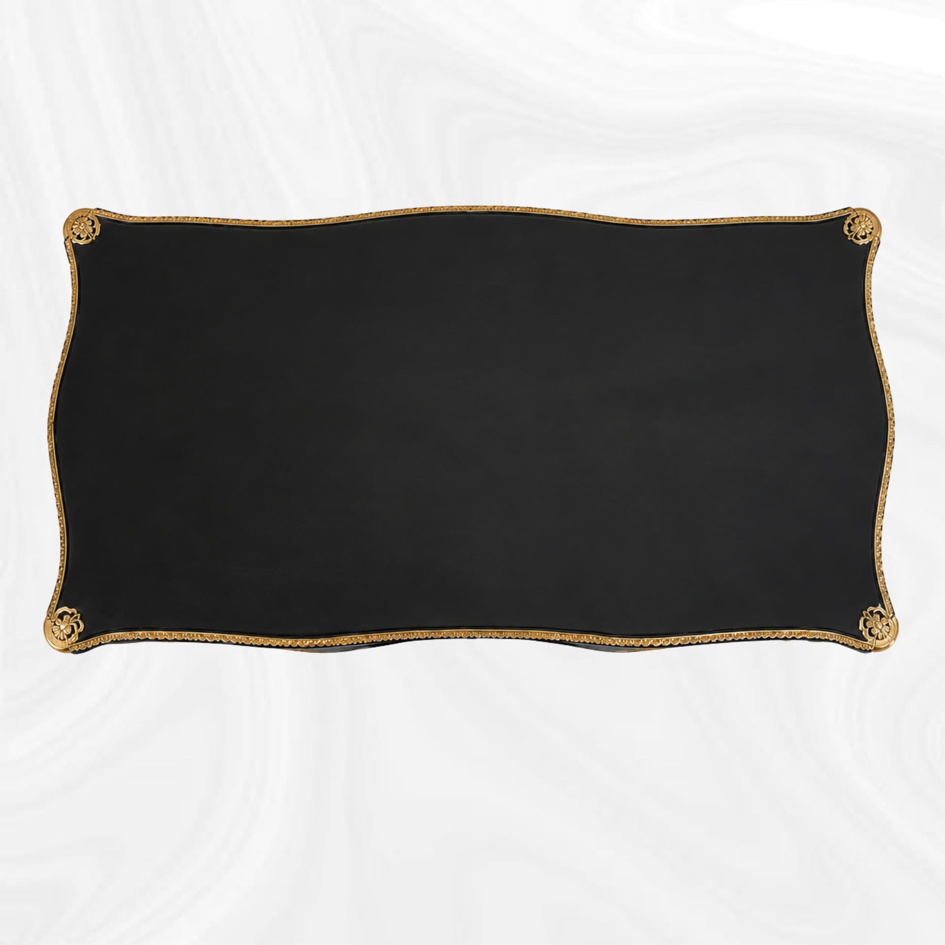 Shaped top of the black and gold writing desk, top view
