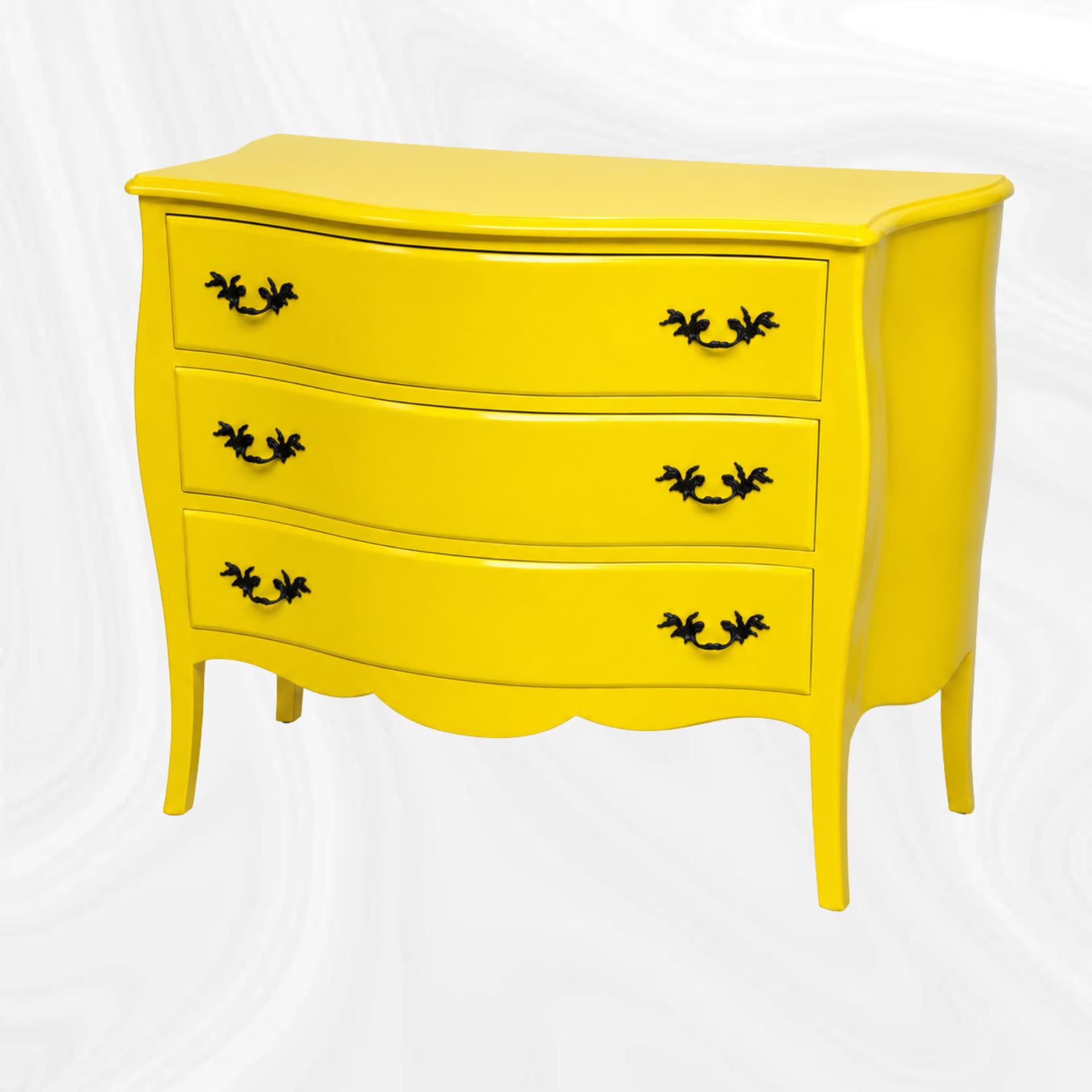 Commode galbee jaune a trois tiroirs, vue de trois quarts