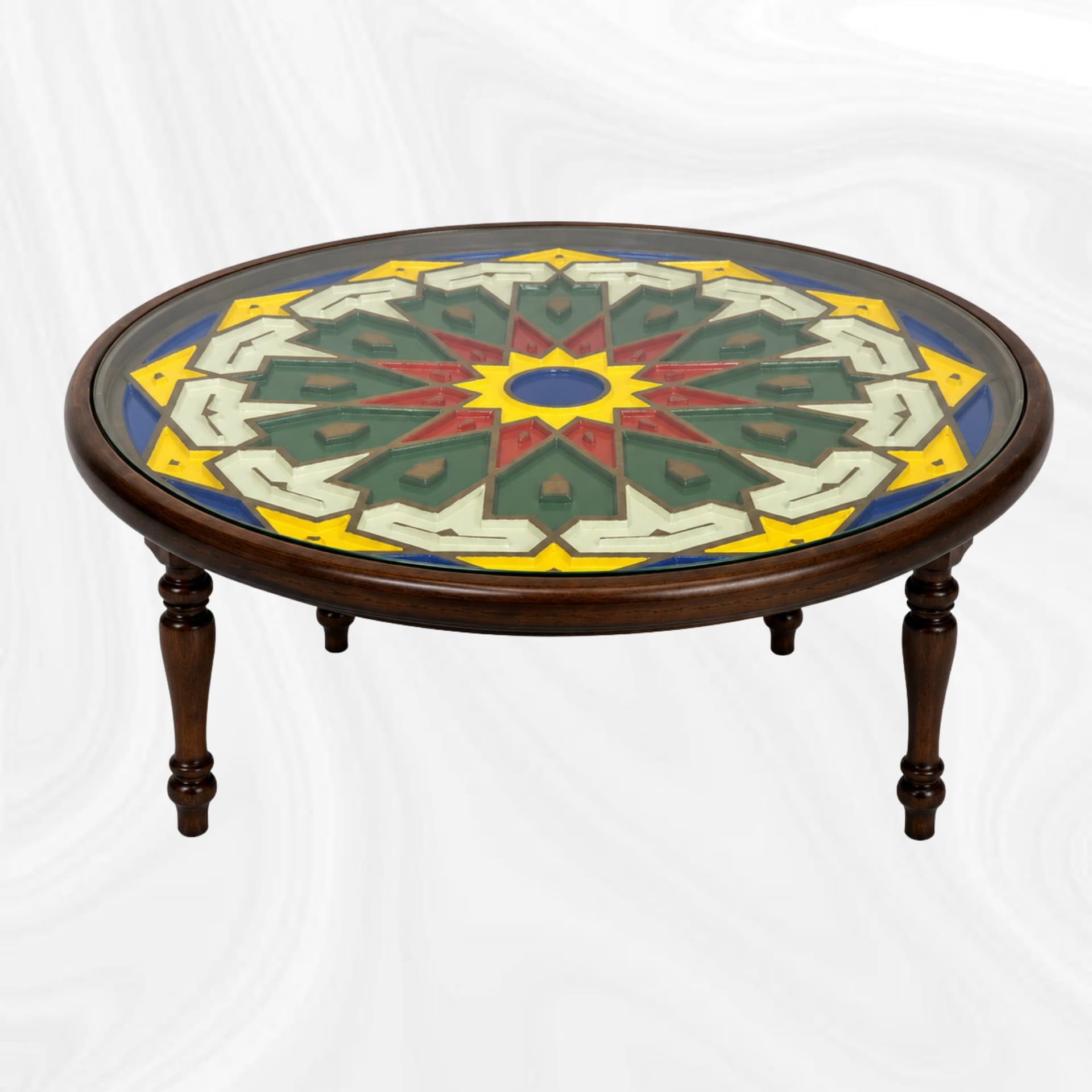 Round coffee table with polychrome geometric decoration, three-quarter view
